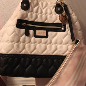 Betsy Johnson handbag. Comes with makeup wallet.